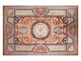 a red and blue rug with a medallion design on it