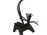 black leather horse ornament on white background with black cord
