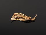 an image of a skeleton leaf floating on a body of water