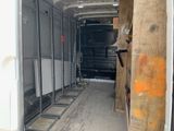 an image of a truck with a lot of wood in the back