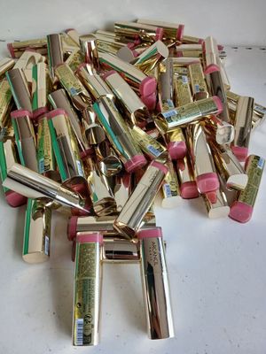 a pile of lipsticks that are on a table