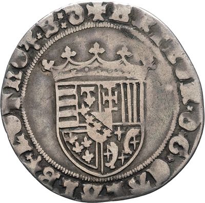 a close up of a coin with a coat of arms on it