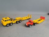 three toy trucks that are sitting next to each other