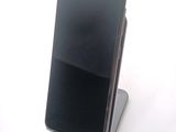 a cell phone that is sitting on top of a stand