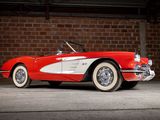 an old red and white car parked in front of a brick wall