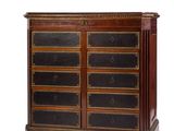 an image of a wooden chest of drawers with black and gold accents