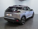 the rear end of a silver suv parked in a showroom
