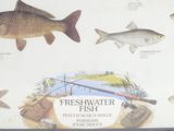 a sign showing different types of fish in the water