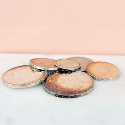 a pile of coins sitting on top of a table