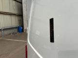 a sticker on the back of a white van