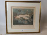 an image of a framed picture of a woman laying on a bed