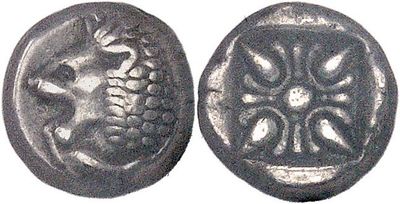 a close up of a coin with a flower design on it