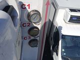 a white truck that has a clock on the side of it
