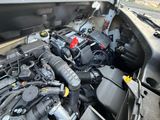 a picture of a car engine with its hood open