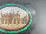 a picture of a picture of a building on the back of a car