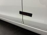 a sticker on the side of a white car
