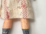 a doll with blood all over it laying on the floor