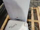 an image of a washing machine sitting on top of a pallet