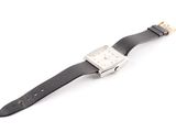 a close up of a watch on a white surface with a white background