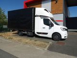 a white truck that is parked in front of a building
