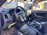 the interior of a car with black leather seats and a steering wheel