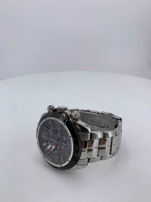 the watch is sitting on a white surface with a white background