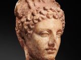 a roman marble head of a woman