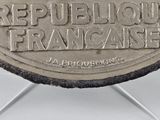 a silver coin with the words republic of france on it