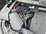 the engine of a car with its hood open and the hood open