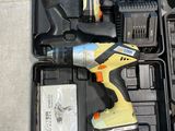 a cordless drill in a tool box with a battery