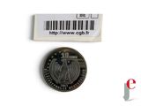 a close up of a coin with a barcode on it