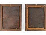 pair of antique wooden picture frames on a white background