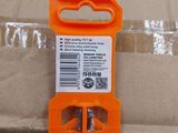 an orange handle on a box that is on the ground