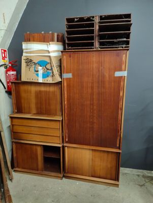 a wooden cabinet with drawers and a box on top