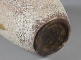 a close up of a vase on a table