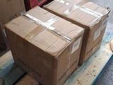 three boxes on a pallet in a warehouse