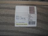 a label on the back of a couch with a price tag on it