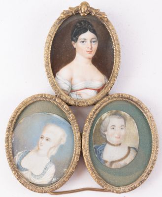three miniature portraits of a woman, a man and a child in a gold frame