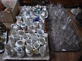 many cups and saucers sitting on a table