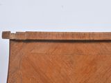 a wooden chair with a wooden seat and a wooden handle
