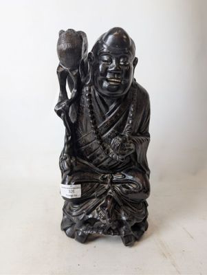 a statue of a man holding a bird in his hand