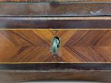 a bird that is sitting on top of a wooden box