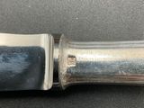 a close up of a knife on a table