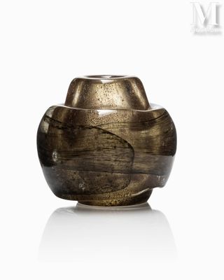 a brown vase that is sitting on a white surface