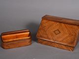 a small wooden box and a small wooden box on a gray surface