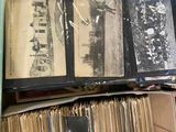 a box full of old books on a shelf