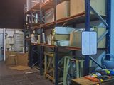 a room that has a lot of shelves and boxes on it