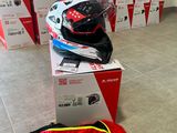 a box with a helmet on top of it next to a bag