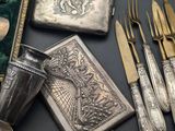 silverware and other silverware on a table