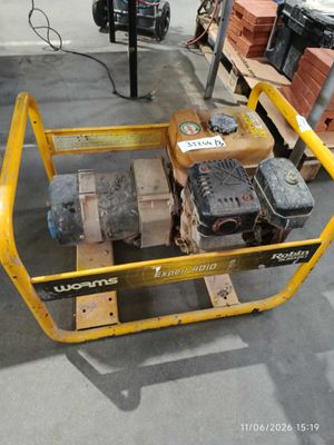a yellow cart that has a small engine on it
